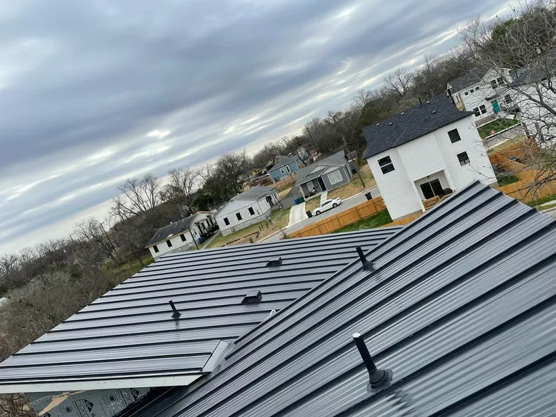 Standing seam metal roof panels with vents for Skylight Repair in Shaw Heights